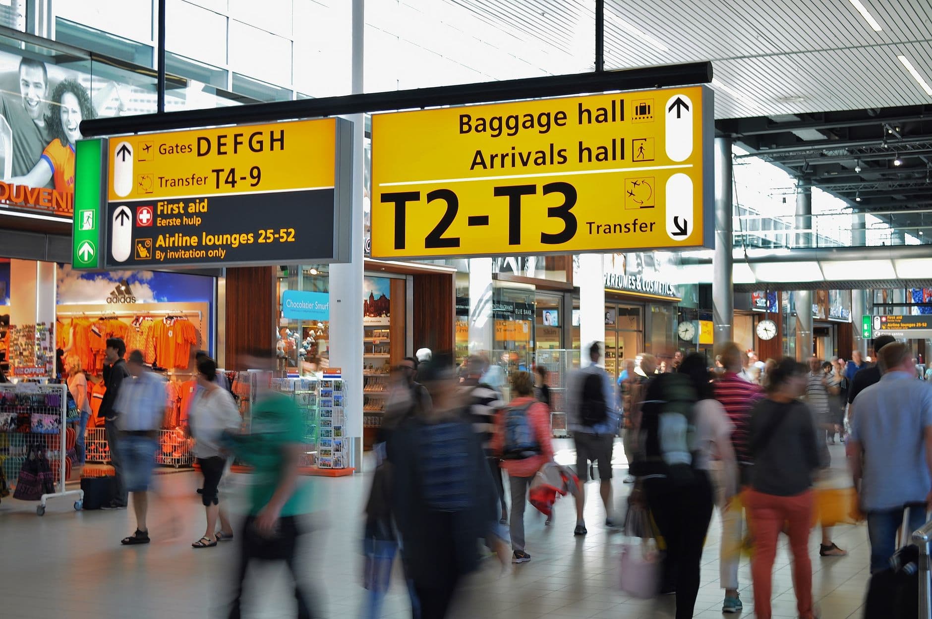 Airport signage displayed in multiple languages