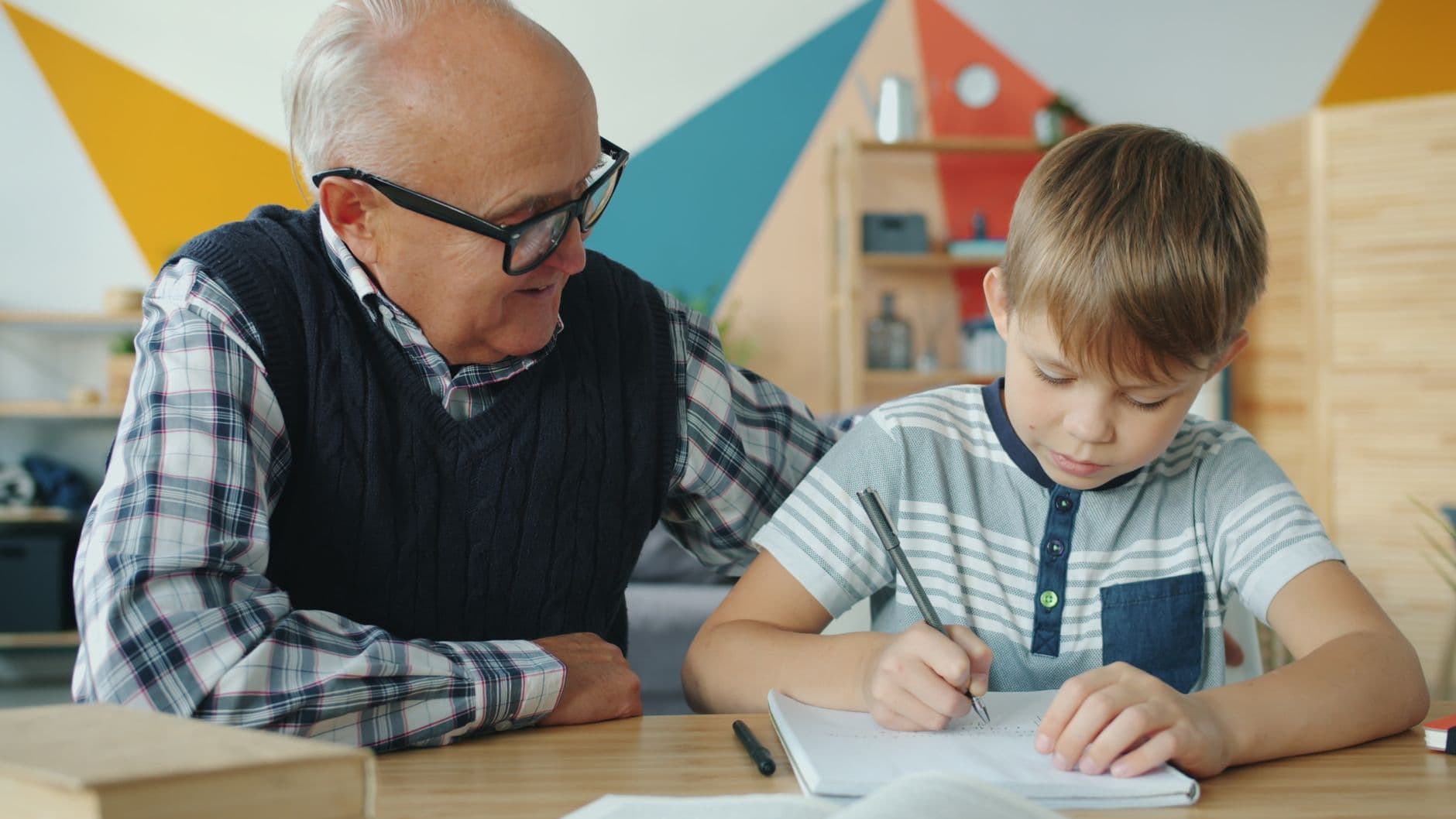 A woman helping her senior parent sort through paperwork