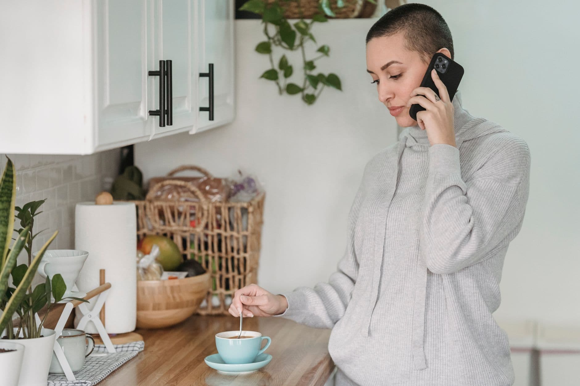 A phone ringing on a kitchen counter